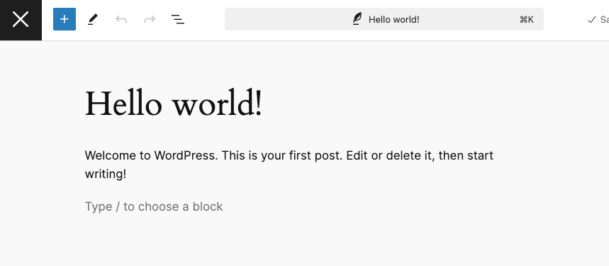 The edit post screen in fullscreen mode displaying a close icon instead of the default W